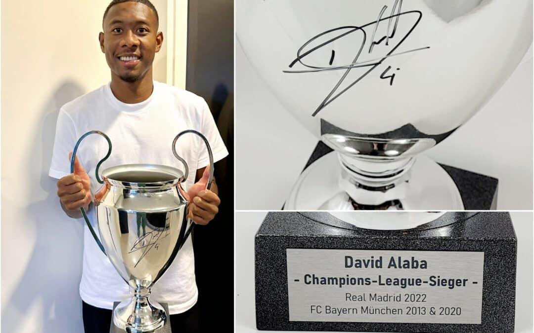 David Alaba signiert CL-Pokal für Kinder in Not